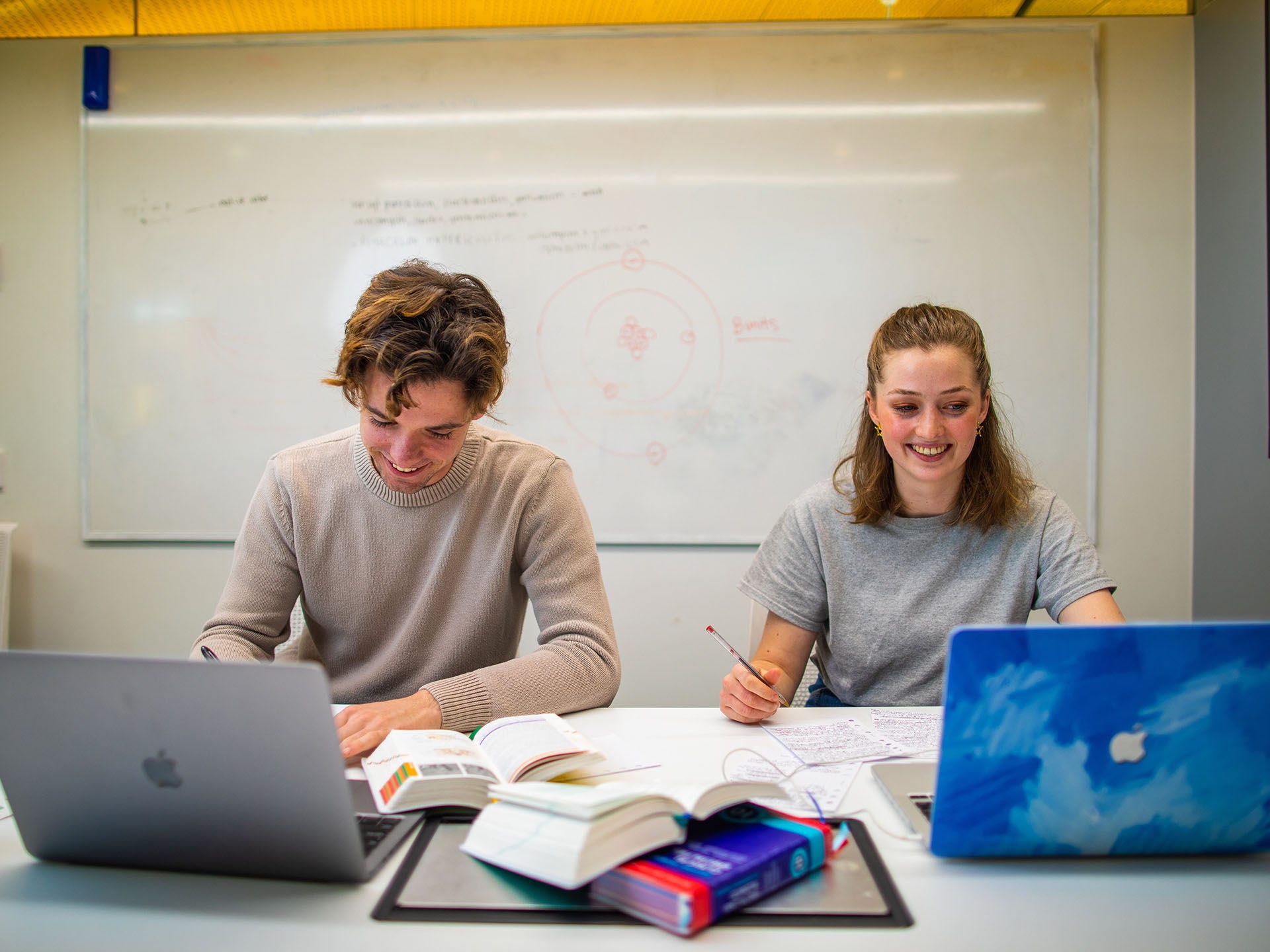 Undergraduate students studying with laptops in a quiet study room in the AHMS building.

Talent:
Sean Stobie - male, grey jumper
Lena Eversheim - female, grey shirt