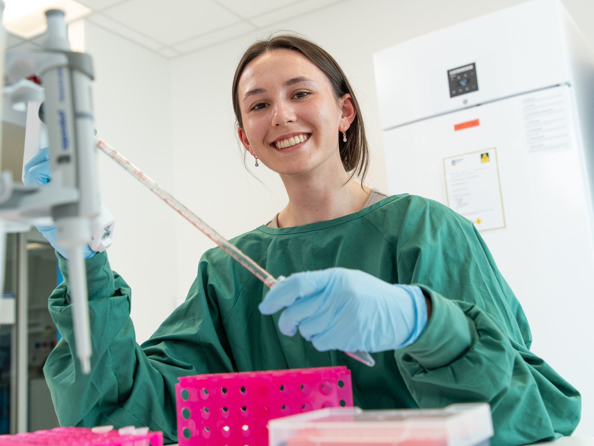 SAiGENCI researcher in a lab