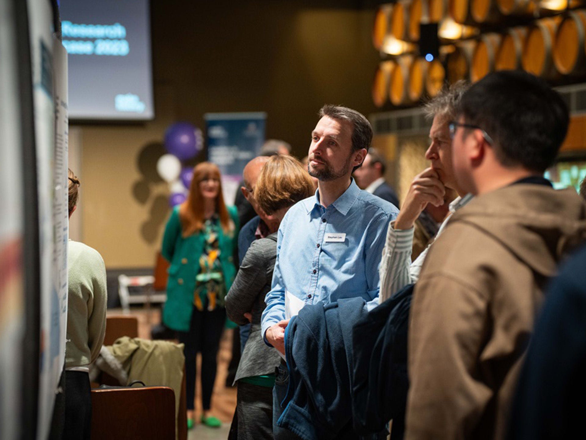 AIML members collaborating at a conference