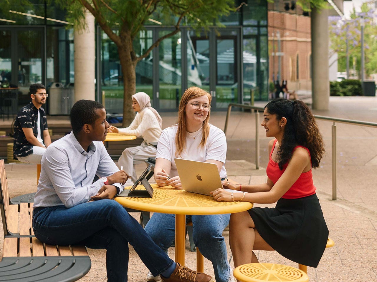 Students on campus having a conversation