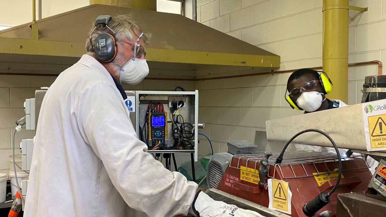 Two men working in a technology lab