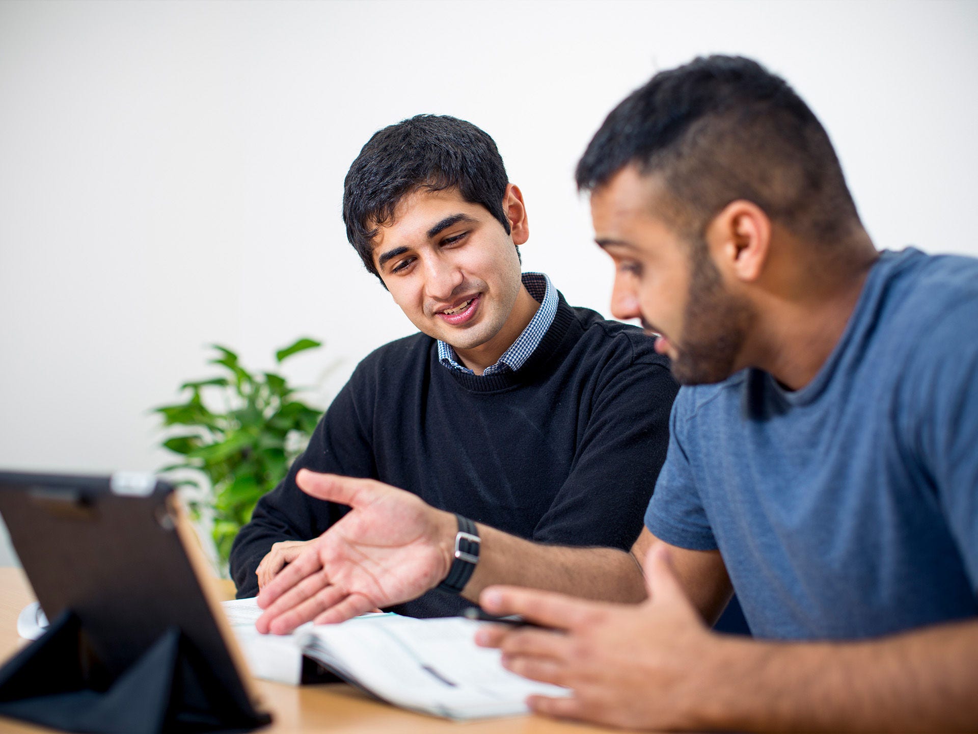 Residents studying in the shared spaces at Adelaide University Village student accommodation