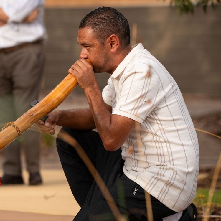 Aboriginal man playing the didgeridoo