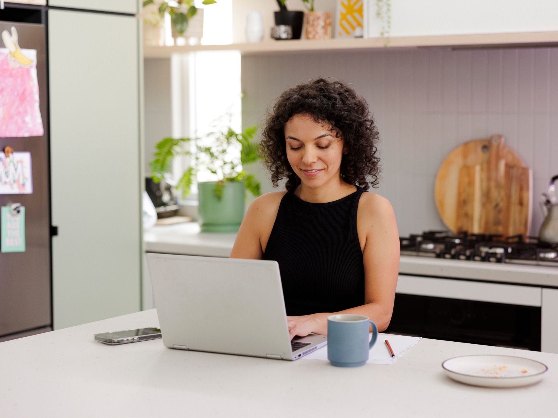 student on a laptop in the kitchen