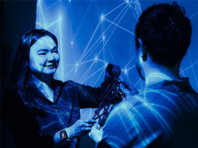 PhD student and supervisors in a AR/VR Lab