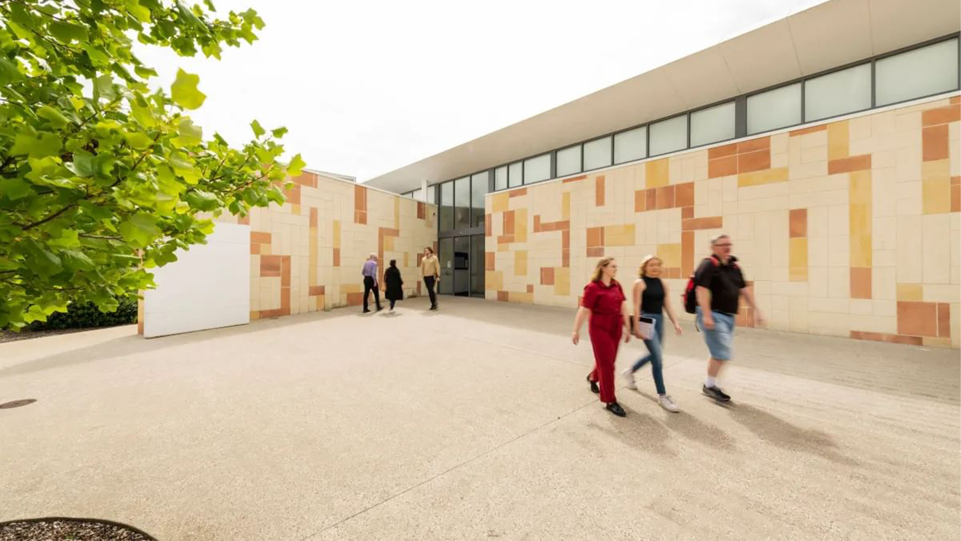People walking out of building