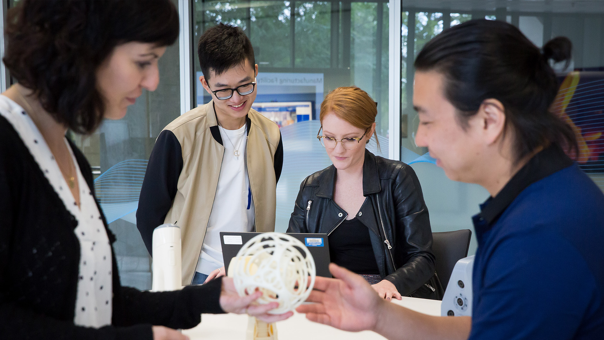 FII team members and researchers in a collaborative lab