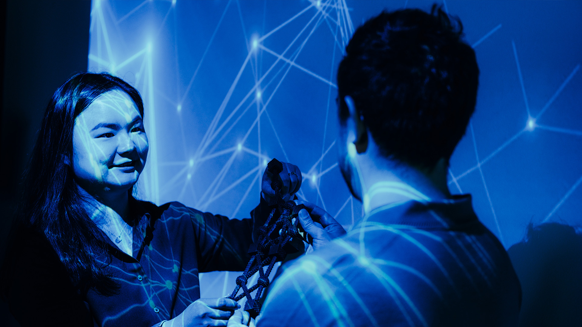 Researcher and PhD student in a lab