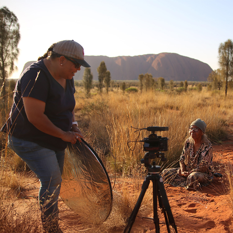 Two people taking photos
