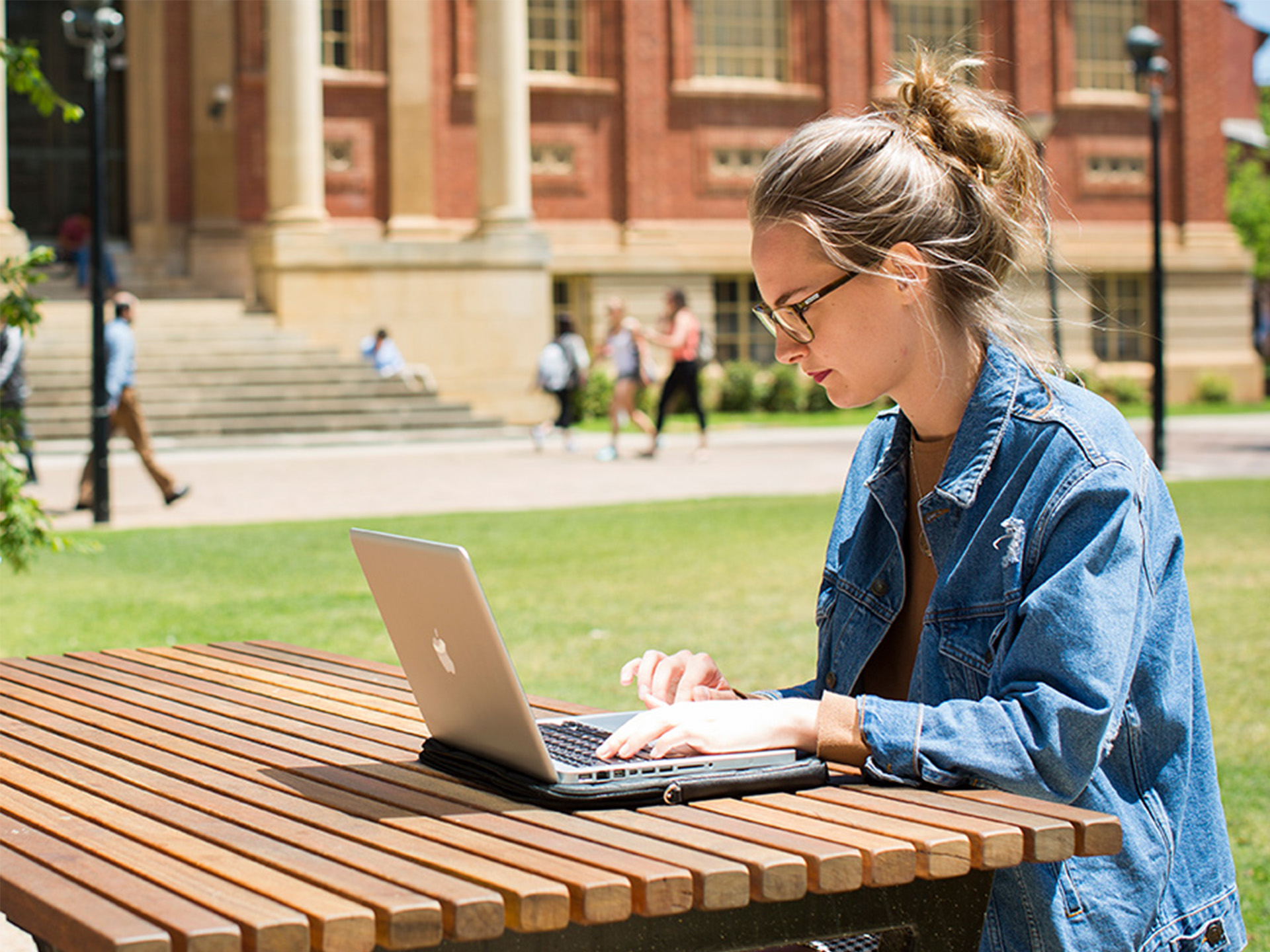 Woman sitting outside with laptop