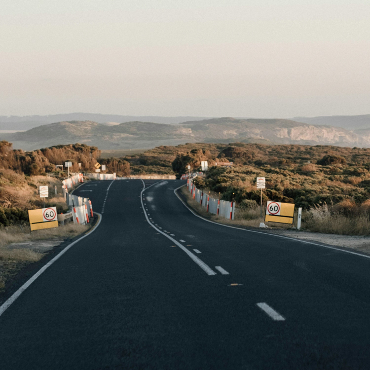 An open road with speed signs 