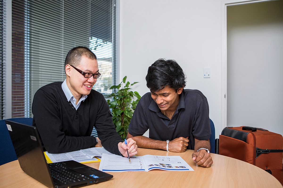 Residents studying in the shared spaces at Adelaide University Village student accommodation