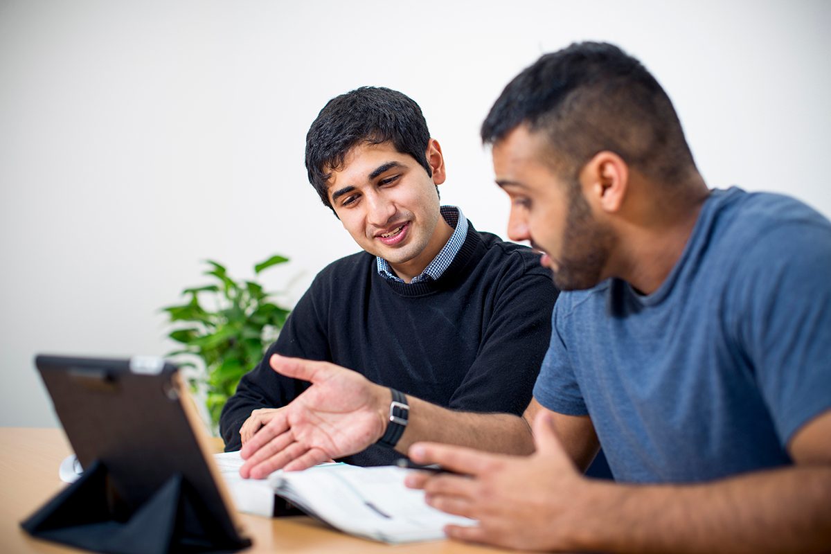 Residents studying in the shared spaces at Adelaide University Village student accommodation