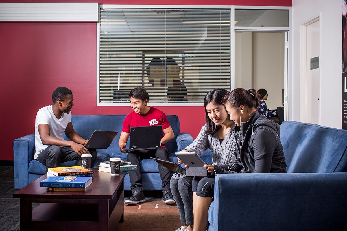 Residents using the common lounge space at Adelaide University Village student accommodation