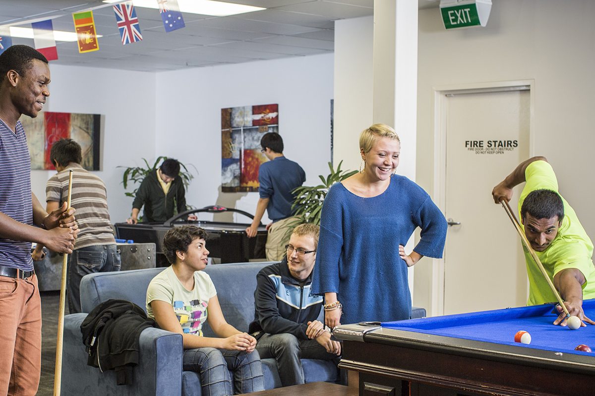 Residents socialising in the shared spaces at Adelaide University Village student accommodation