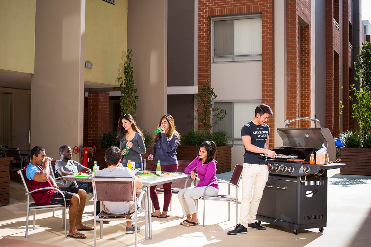 Residents socialising at Adelaide University Village student accommodation